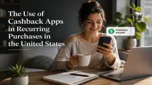 Woman using a cashback app on her smartphone while managing recurring purchases at home, illustrating smart savings habits and digital financial tools in the United States.